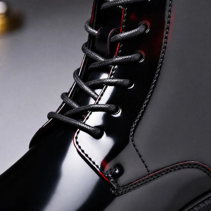 Lace-up front close-up on black cherry men's ankle boot