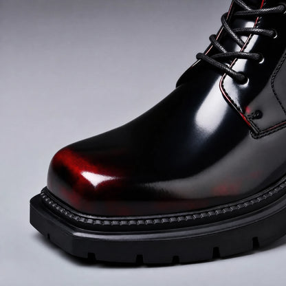 Burnished red toe and lug sole detail on black cherry lace up boot