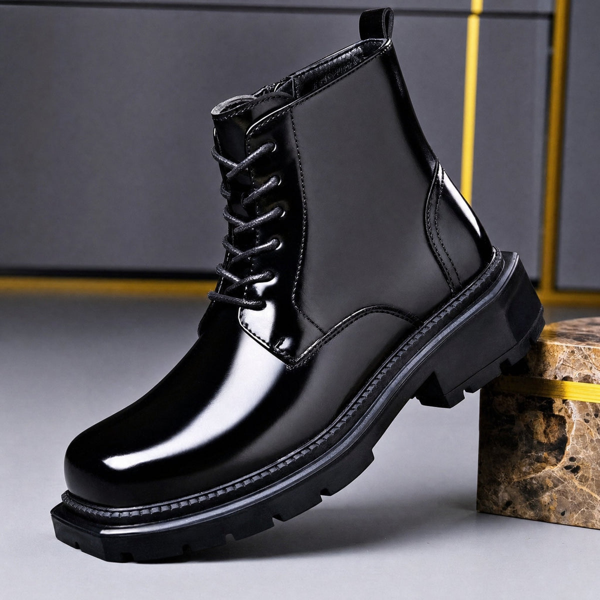 Black men's lace up boot with high-shine finish and lug sole