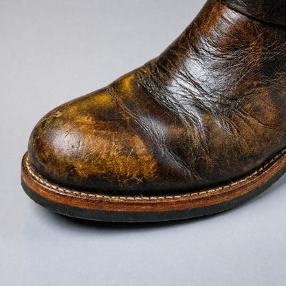 Rounded toe close-up on distressed vintage brown engineer boot